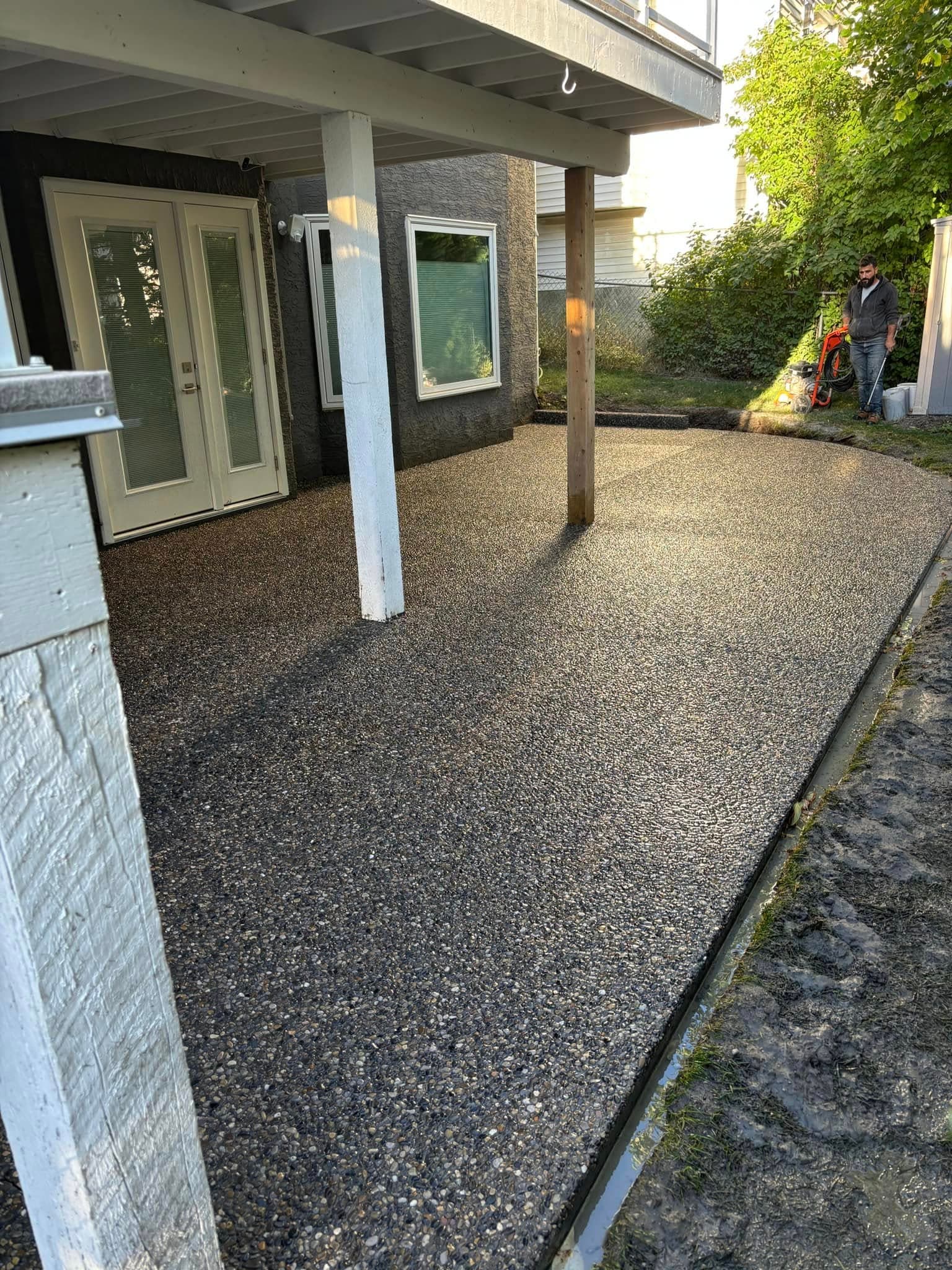 Residential concrete backyard patio under construction